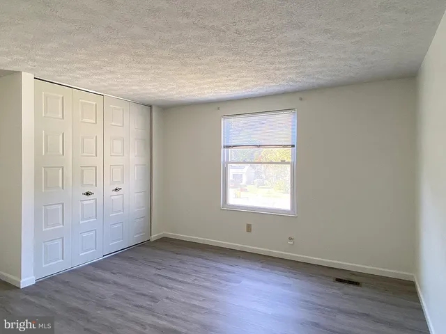 a view of a house with wooden deck