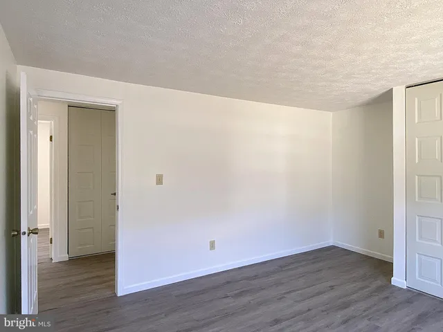 a view of a swimming pool with outdoor seating