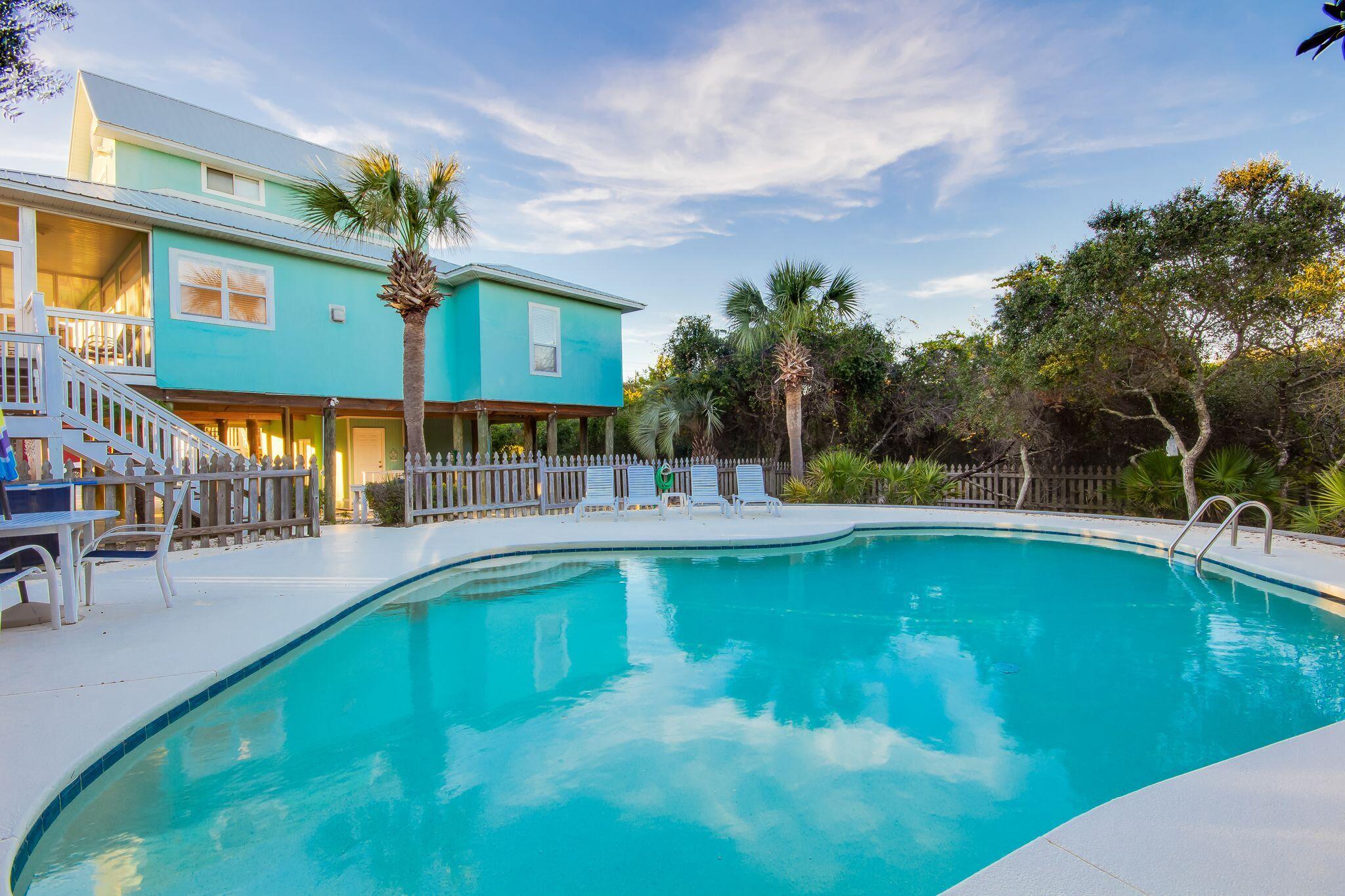 a view of a swimming pool with a patio