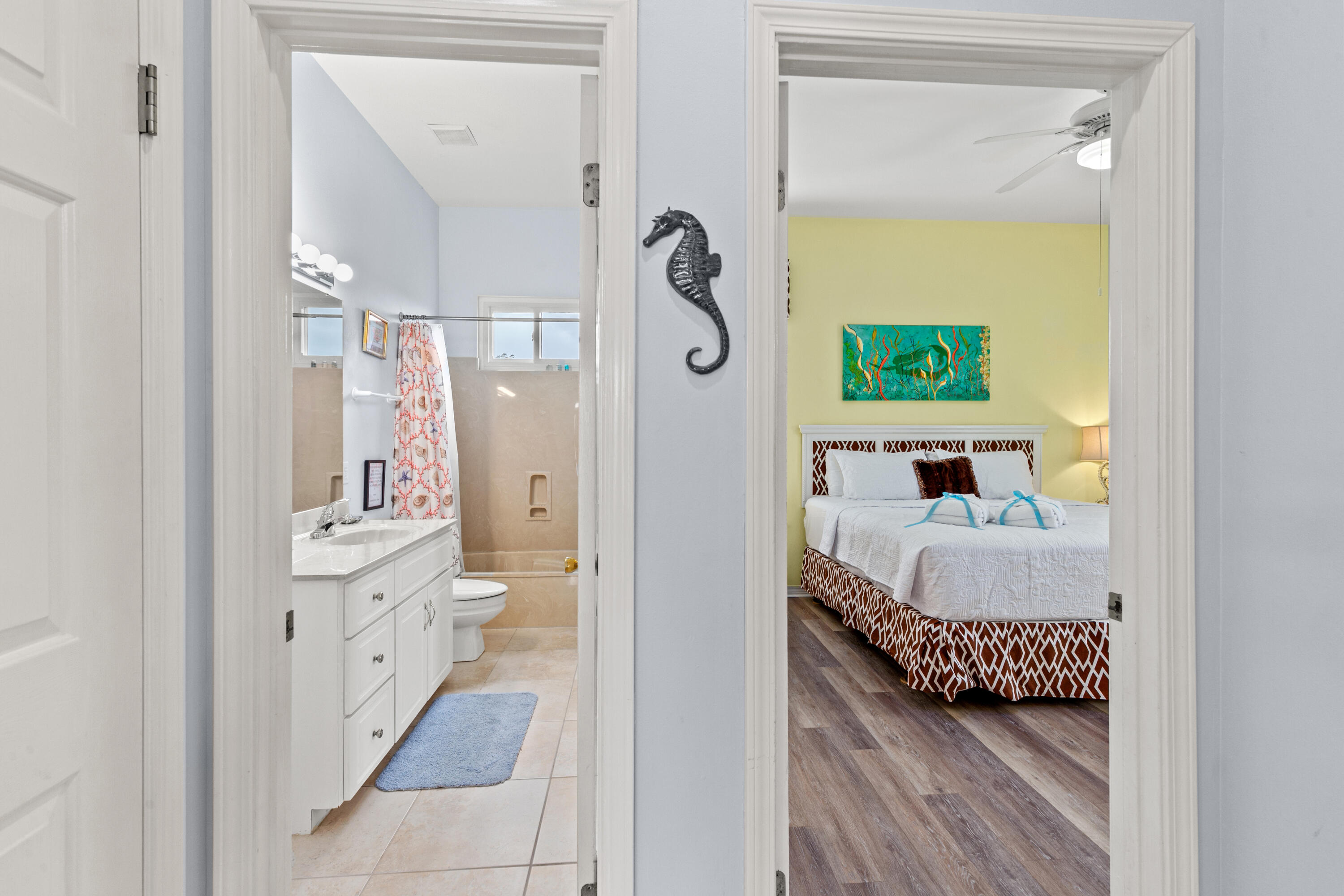 2305 South Co Highway 83 Santa Rosa Beach, FL 32459 - Photo 19 of 36 a en suite bathroom with a granite countertop sink and a mirror