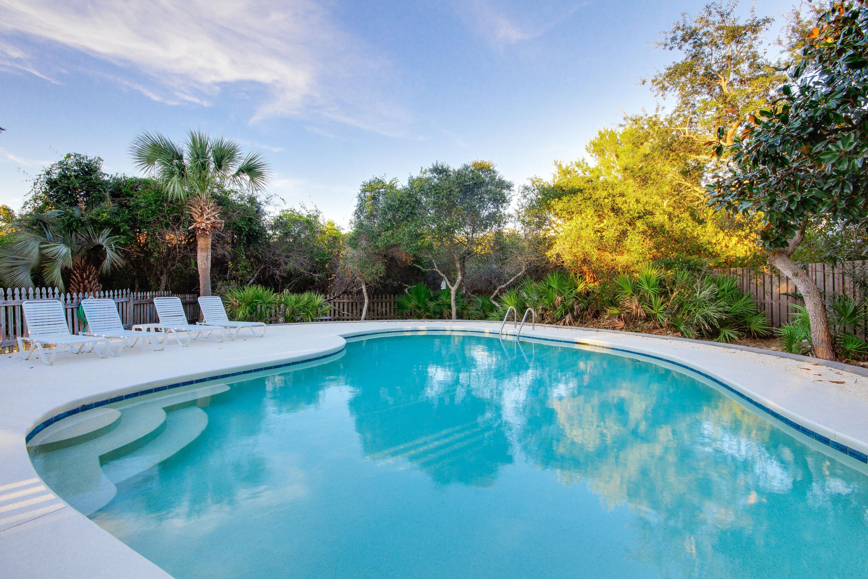2305 South Co Highway 83 Santa Rosa Beach, FL 32459 - Photo 2 of 36 a view of a swimming pool with a yard