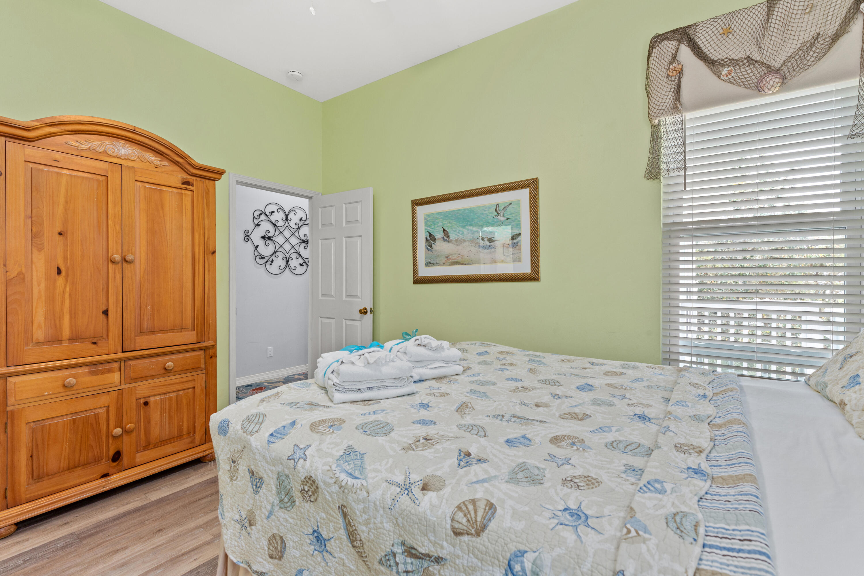 2305 South Co Highway 83 Santa Rosa Beach, FL 32459 - Photo 25 of 36 a bedroom with a bed and cabinets