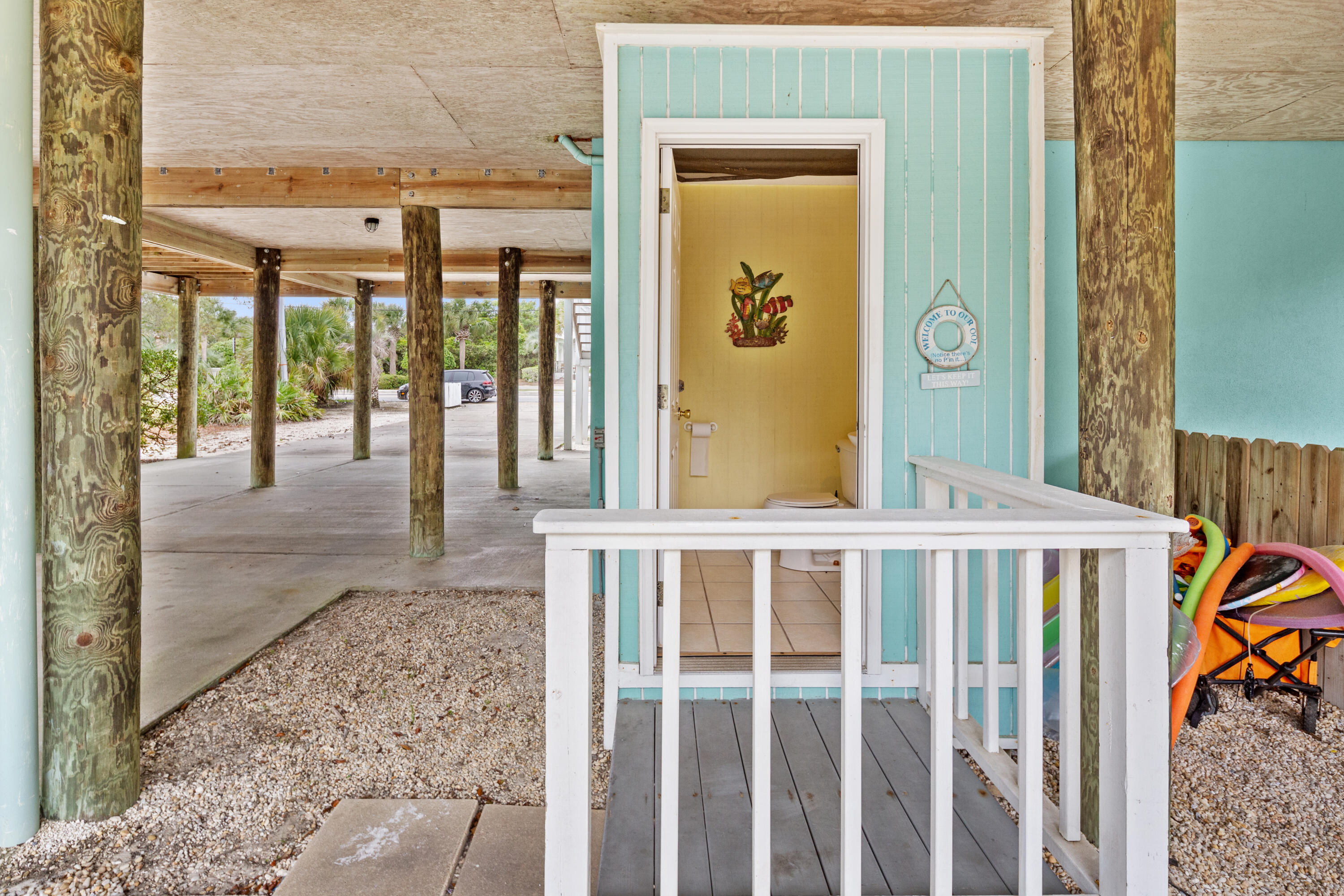 2305 South Co Highway 83 Santa Rosa Beach, FL 32459 - Photo 5 of 36 a view of a porch with a table and chairs