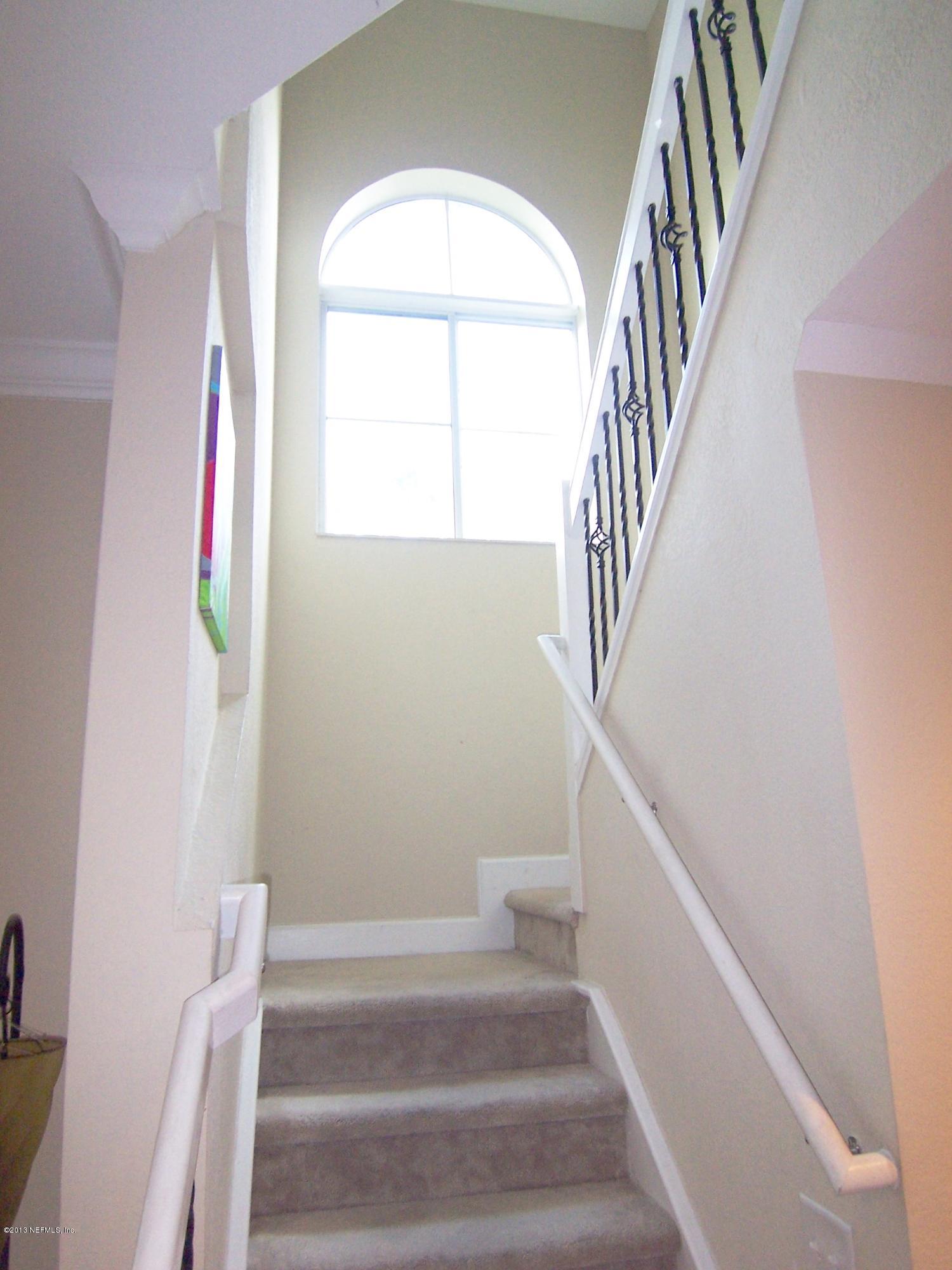 9745 Touchton Road, Unit 930 Jacksonville, FL 32246 - Photo 8 of 27 Stairs with arched window