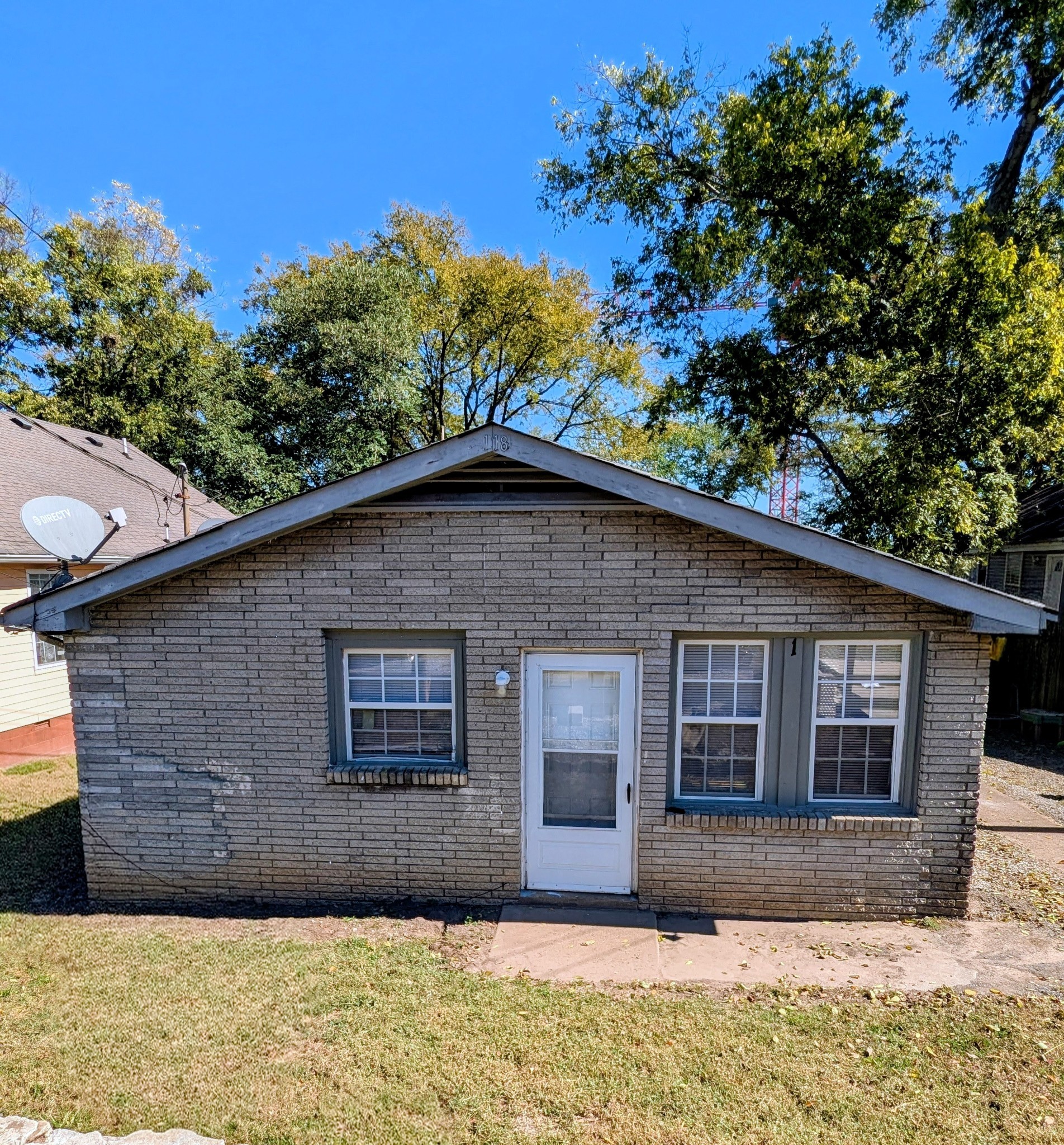 118 Rains Avenue, Unit 2 Nashville, TN 37203 - Photo 3 of 3 a front view of a house with a garden
