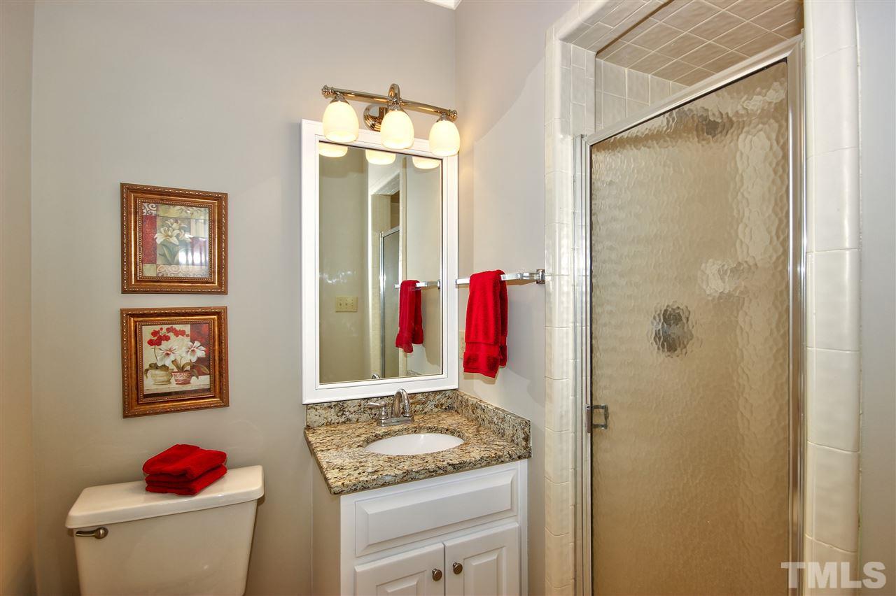10520 New Arden Way Raleigh, NC 27613 - Photo 14 of 25 Full bathroom off downstairs bedroom with walk in shower.