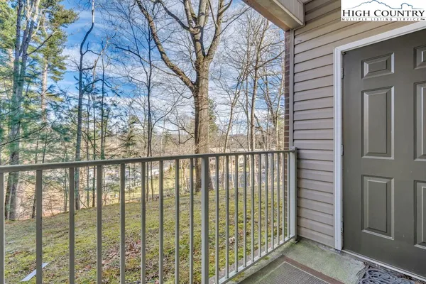 a view of a balcony with a tree