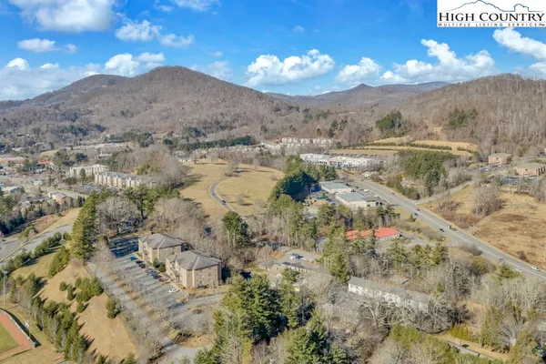 a view of a swimming pool with a yard