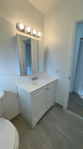 a bathroom with a sink and mirror