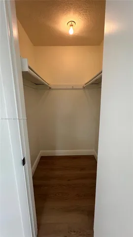a view of an empty walk in closet