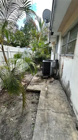 a view of a backyard with sitting area