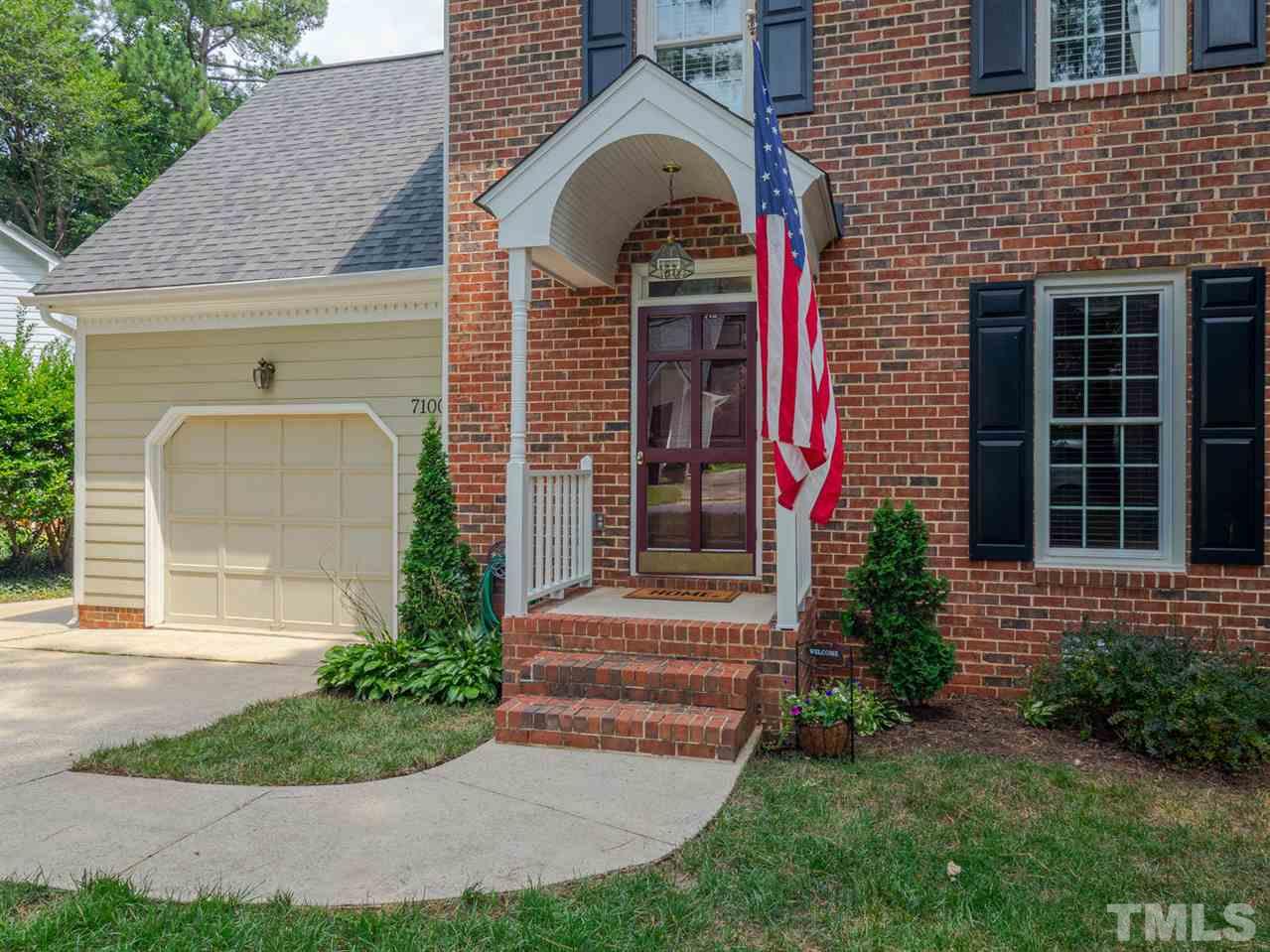 7100 Kinross Drive Raleigh, NC 27613 - Photo 2 of 24 a front view of a house with garden
