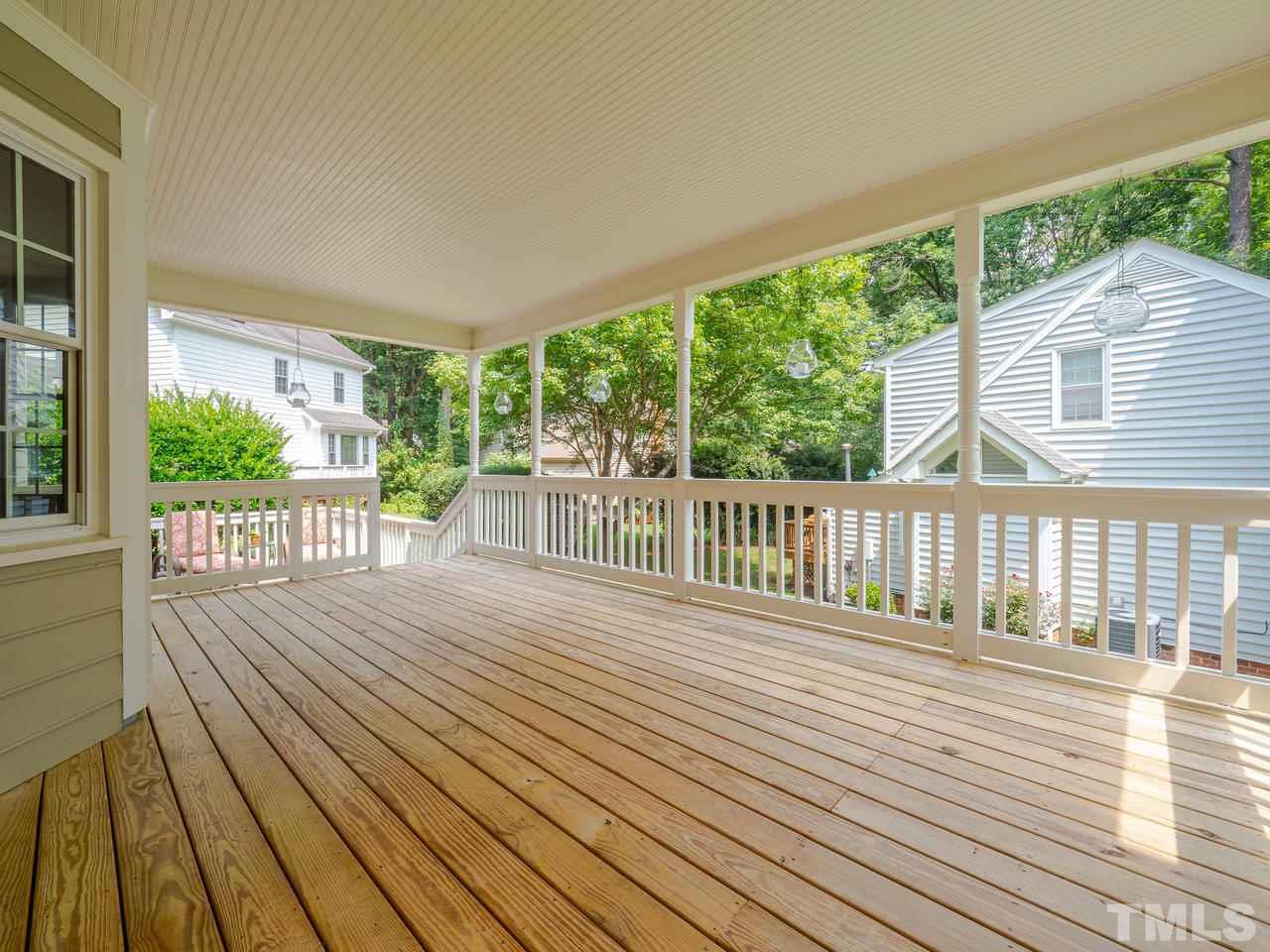 7100 Kinross Drive Raleigh, NC 27613 - Photo 19 of 24 a view of a wooden deck with a yard