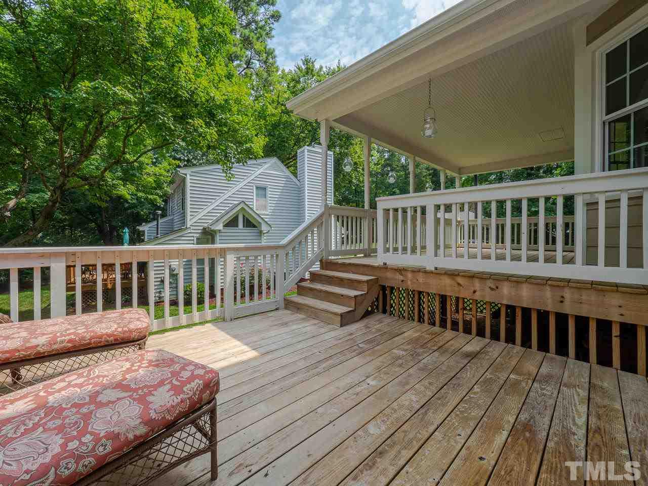 7100 Kinross Drive Raleigh, NC 27613 - Photo 20 of 24 a view of a wooden deck and a yard