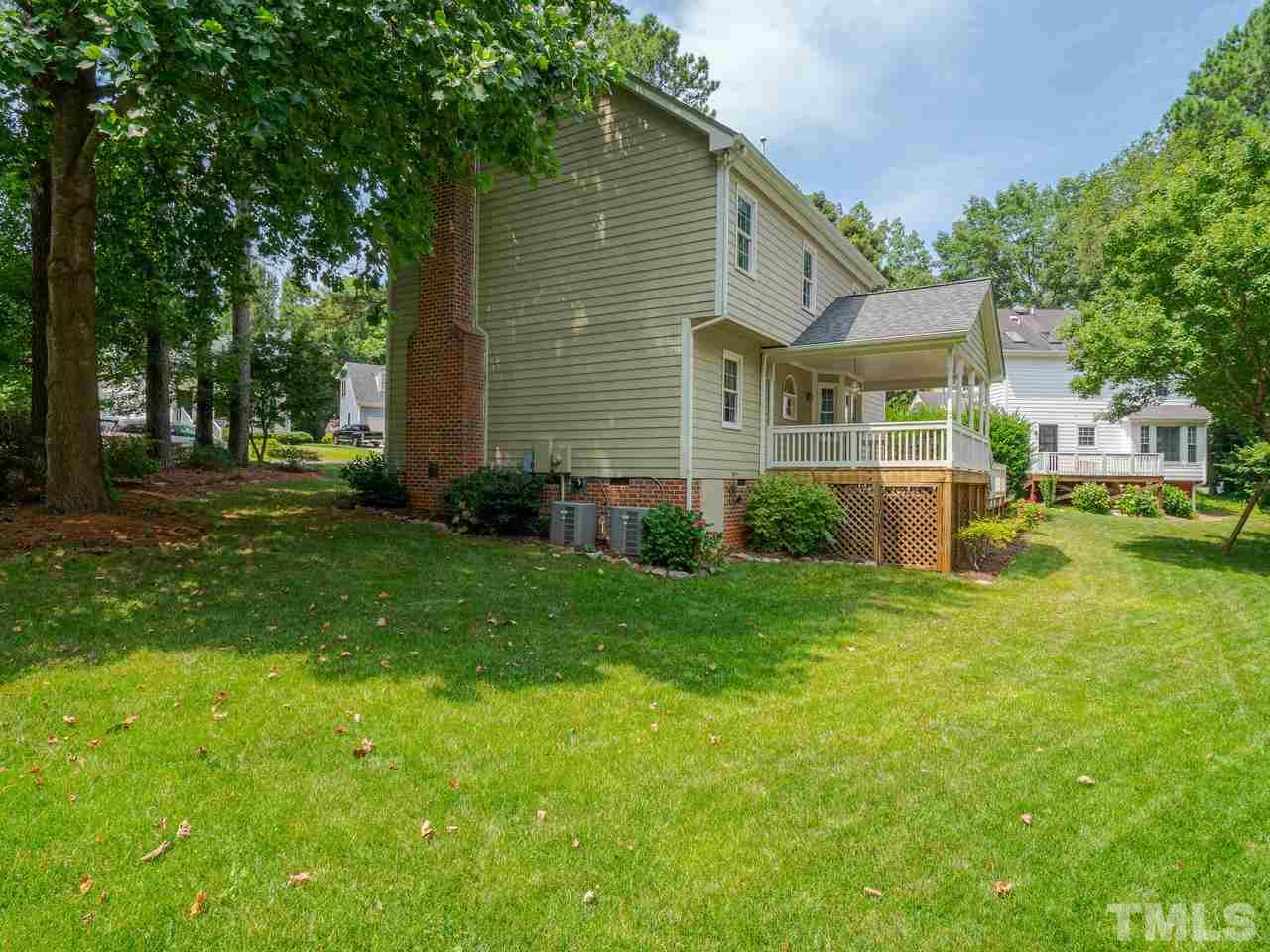 7100 Kinross Drive Raleigh, NC 27613 - Photo 23 of 24 a view of backyard of house with green space