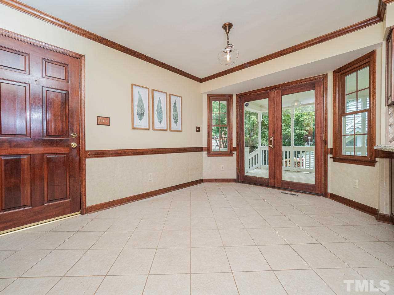 7100 Kinross Drive Raleigh, NC 27613 - Photo 8 of 24 a view of an empty room with a window