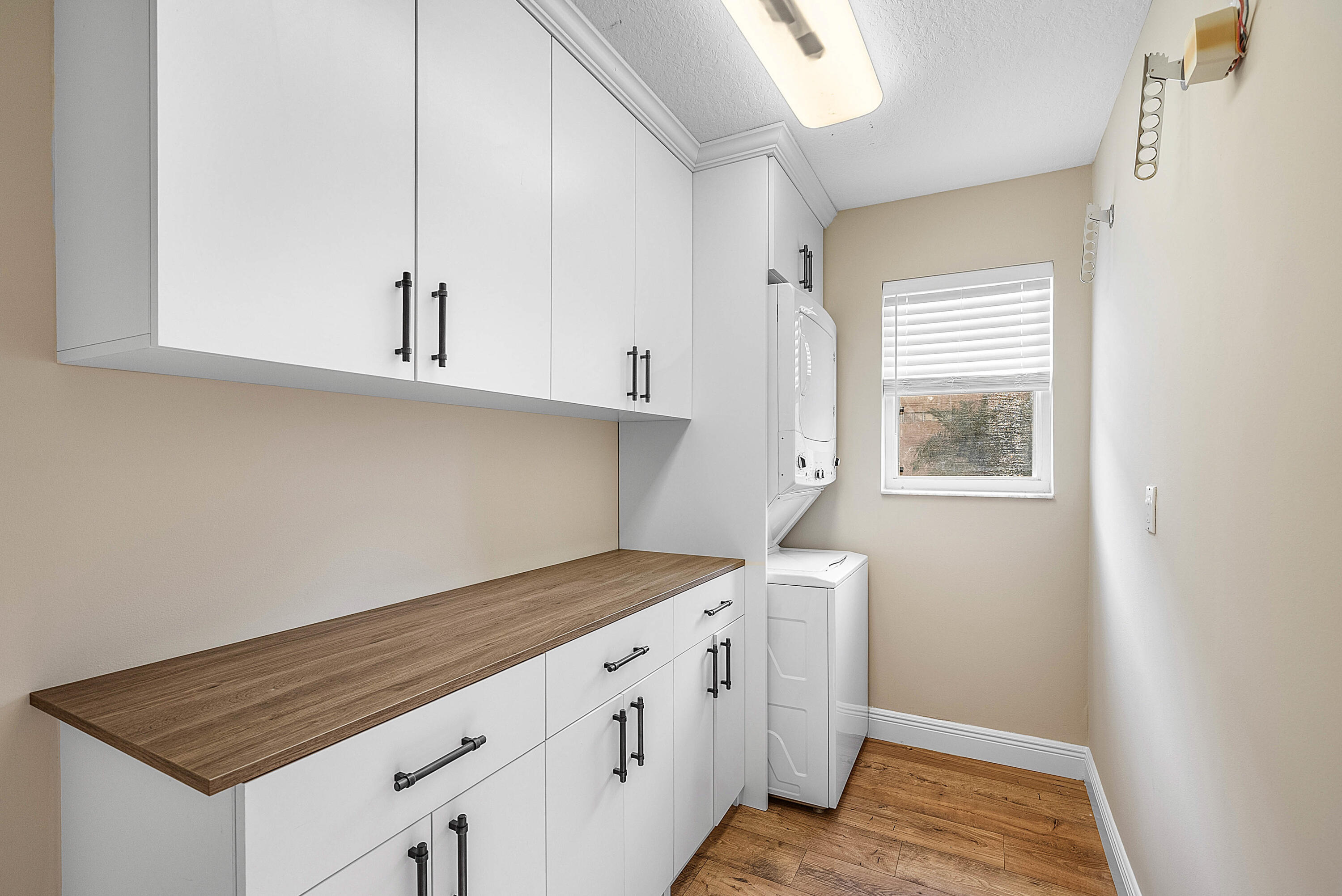 22345 Siesta Key Drive Boca Raton, FL 33428 - Photo 15 of 45 a kitchen with white cabinets and window