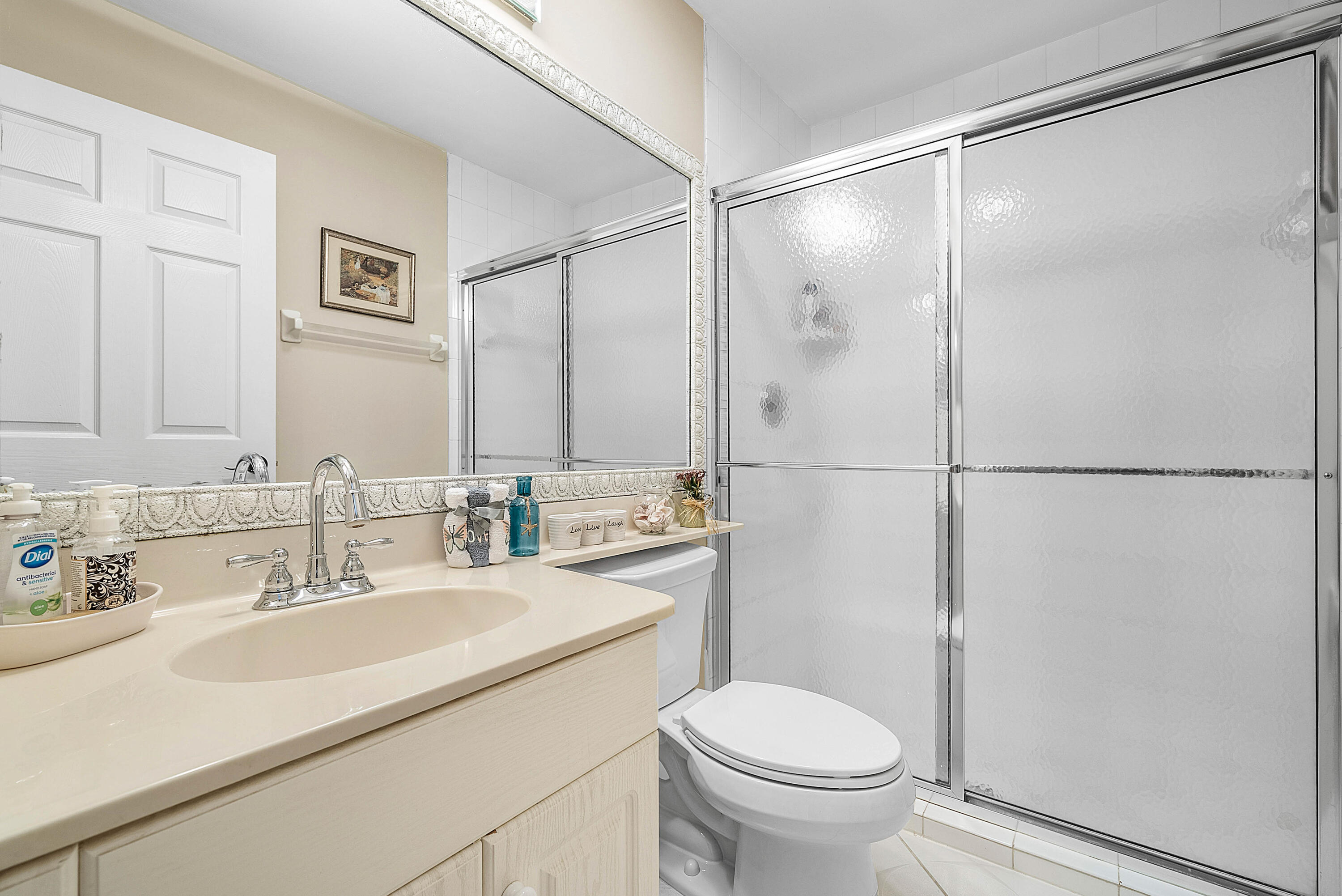22345 Siesta Key Drive Boca Raton, FL 33428 - Photo 23 of 45 a bathroom with a sink toilet and shower