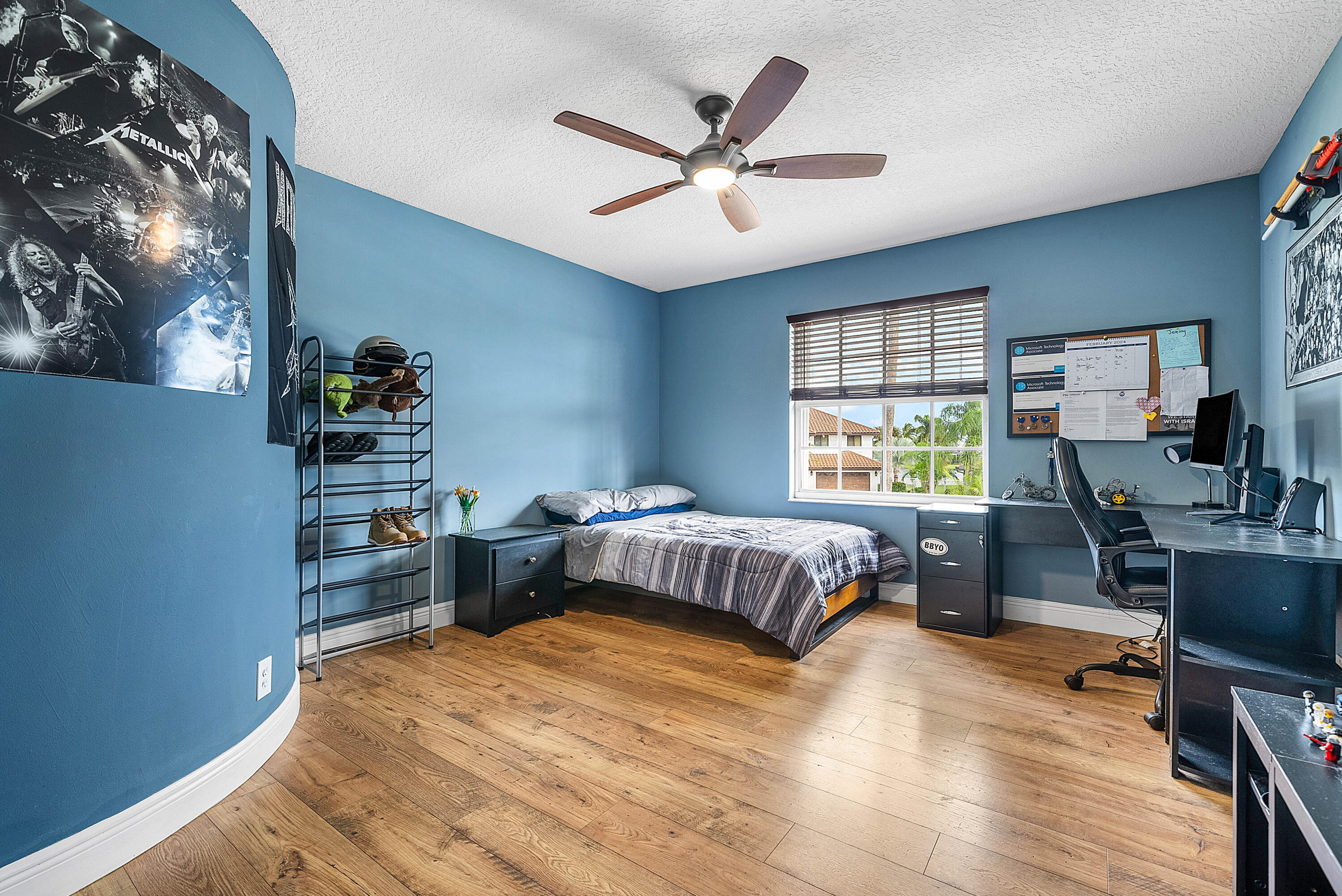 22345 Siesta Key Drive Boca Raton, FL 33428 - Photo 27 of 45 a bedroom with a bed and wooden floor