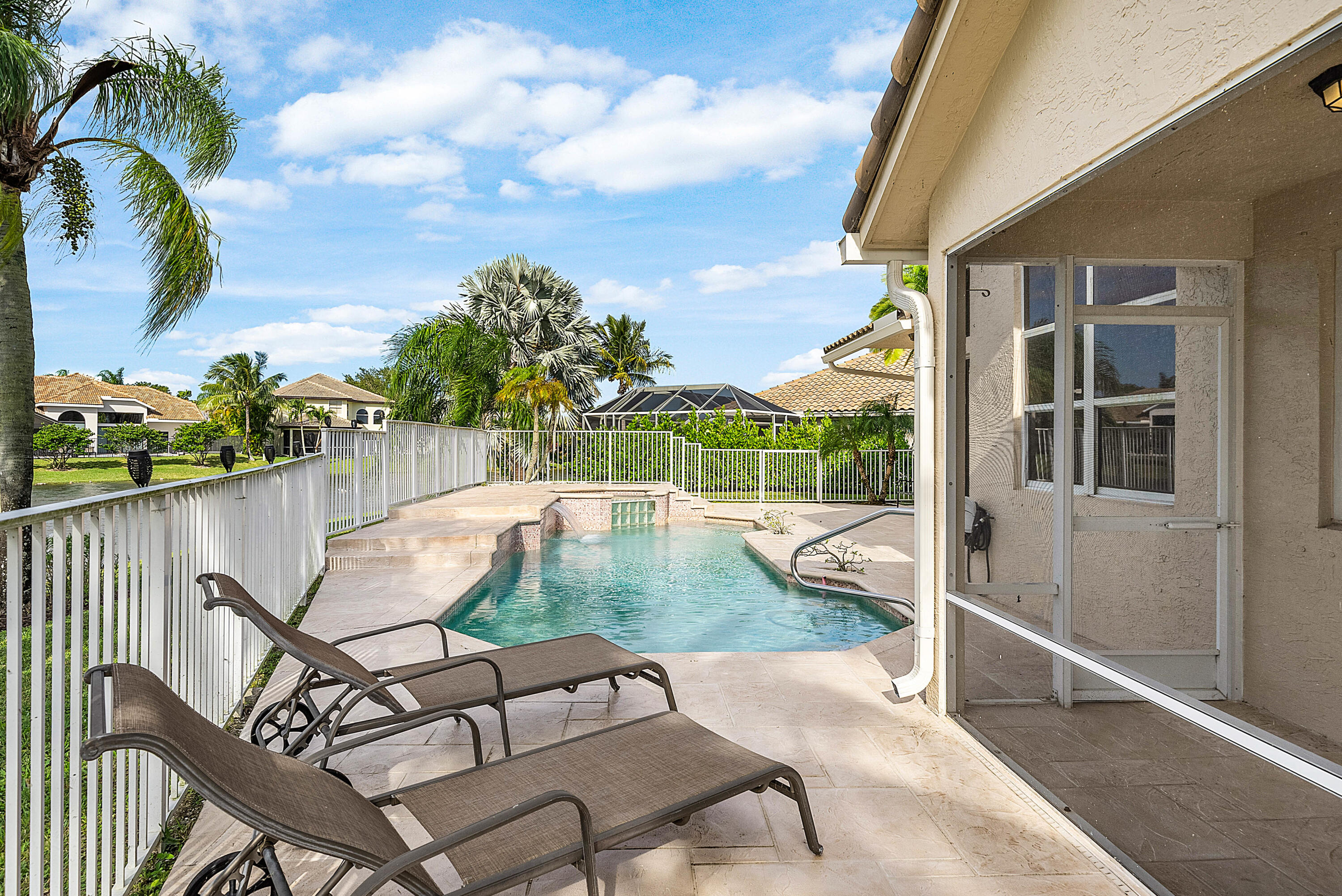 22345 Siesta Key Drive Boca Raton, FL 33428 - Photo 33 of 45 a view of a swimming pool with a lounge chairs