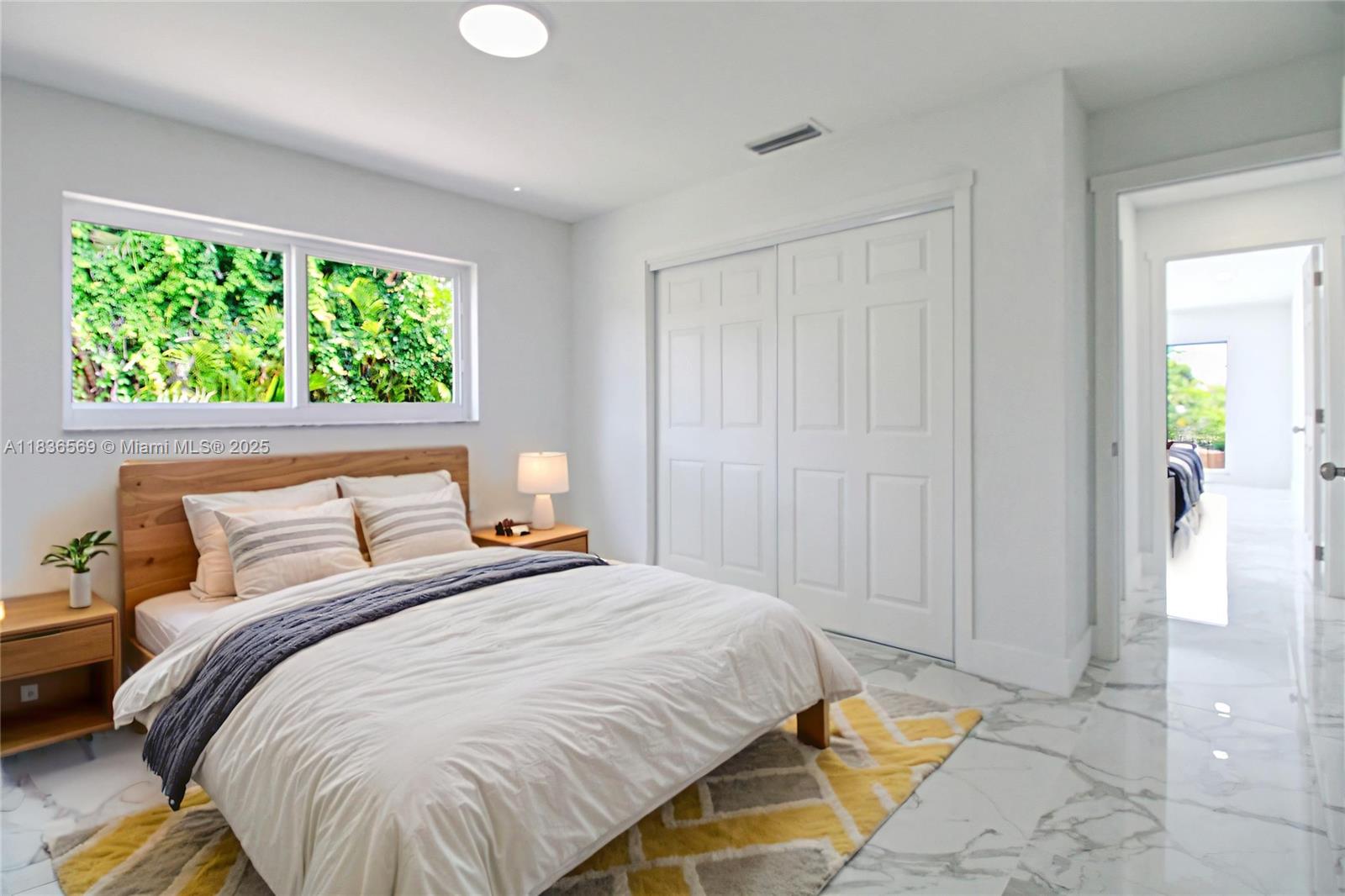 4808 Mango Drive Tamarac, FL 33319 - Photo 12 of 36 a bedroom with a bed and a window