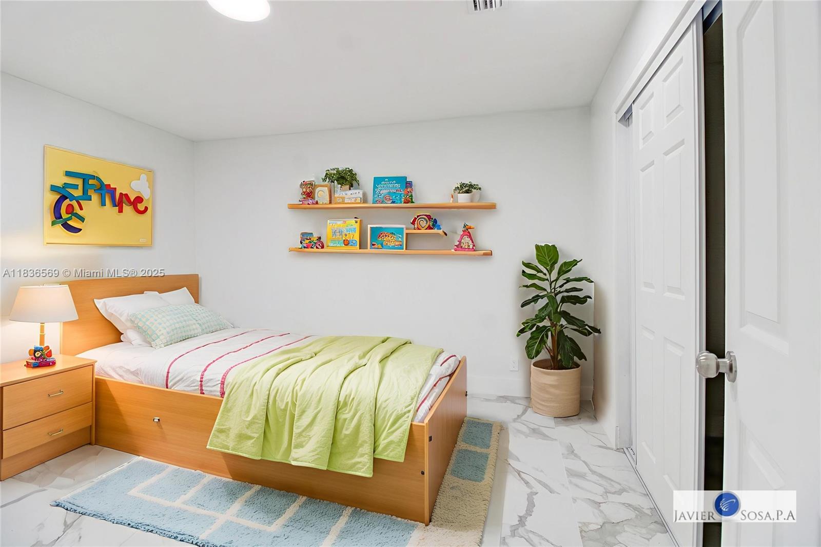 4808 Mango Drive Tamarac, FL 33319 - Photo 15 of 36 a bedroom with a bed and a potted plant