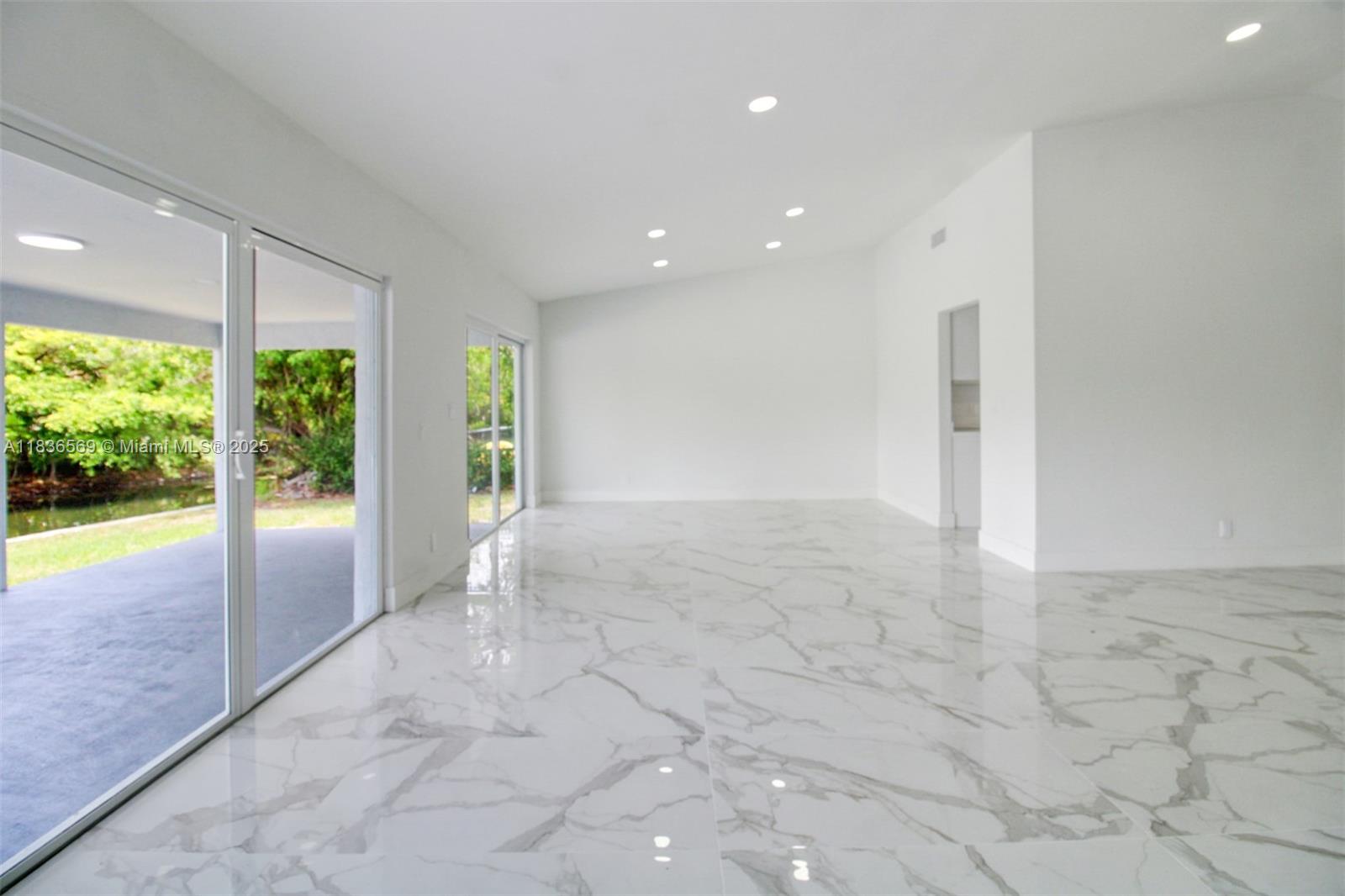 4808 Mango Drive Tamarac, FL 33319 - Photo 21 of 36 a view of an empty room and window