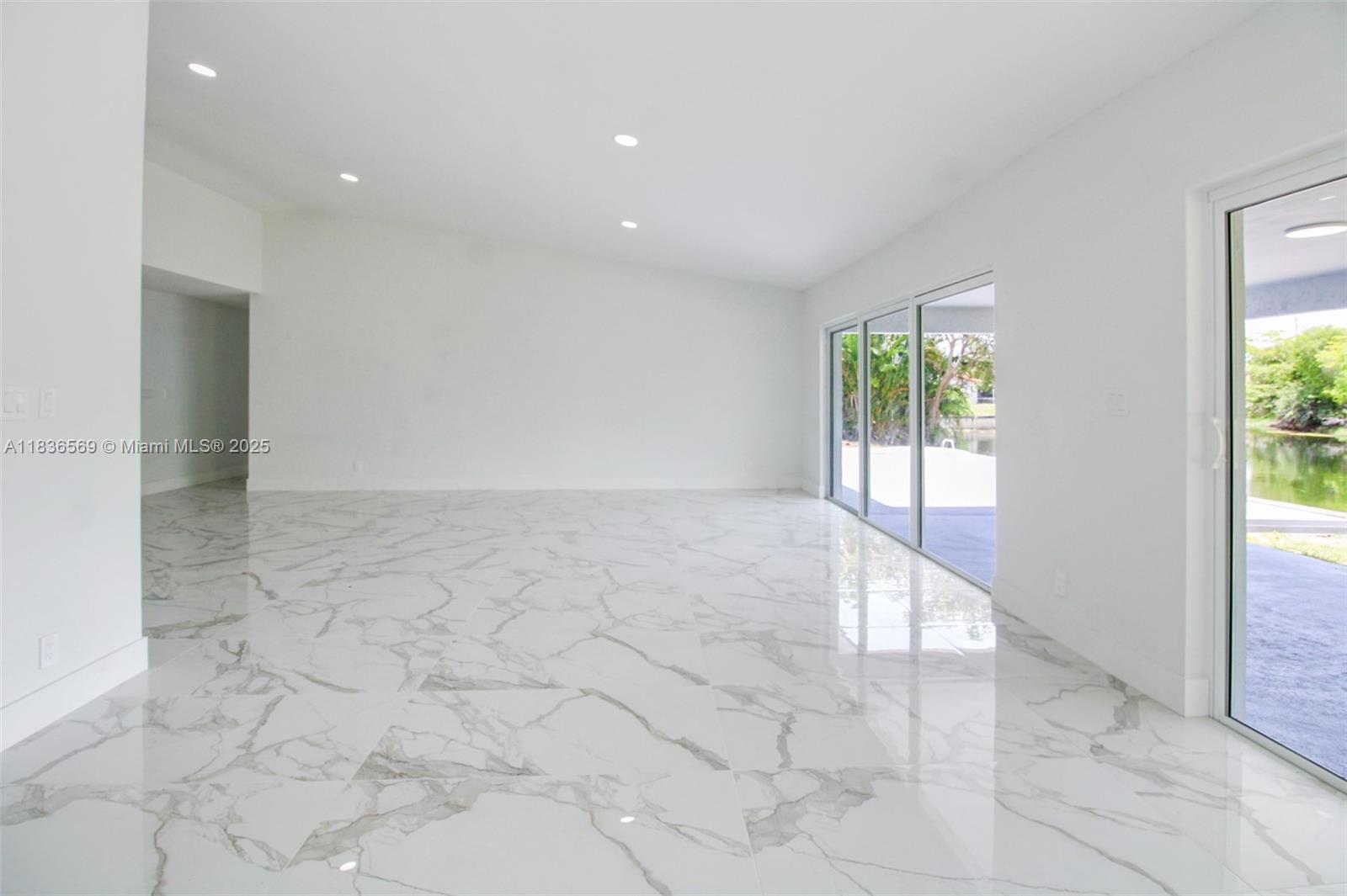 4808 Mango Drive Tamarac, FL 33319 - Photo 23 of 36 a view of an empty room with a window