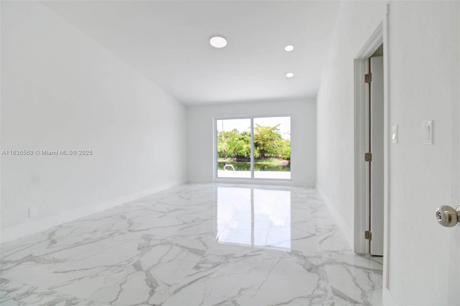 4808 Mango Drive Tamarac, FL 33319 - Photo 25 of 36 a view of an empty room and a window