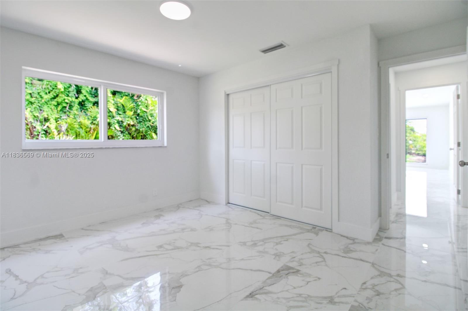 4808 Mango Drive Tamarac, FL 33319 - Photo 27 of 36 a view of an empty room with a window