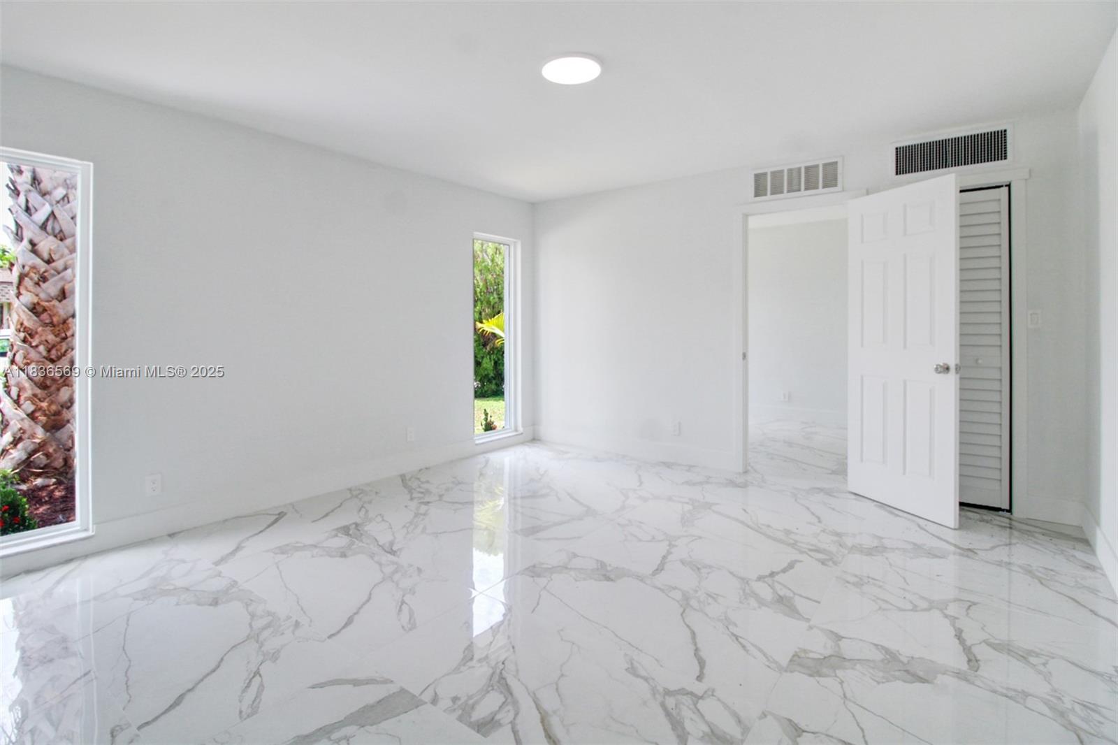 4808 Mango Drive Tamarac, FL 33319 - Photo 29 of 36 an empty room with windows