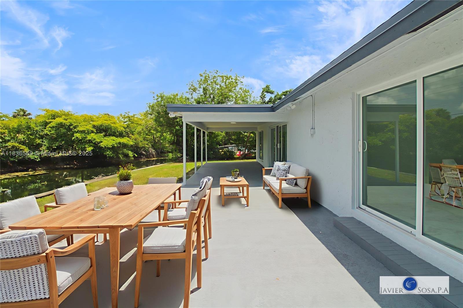 4808 Mango Drive Tamarac, FL 33319 - Photo 30 of 36 a view of yard from deck with patio