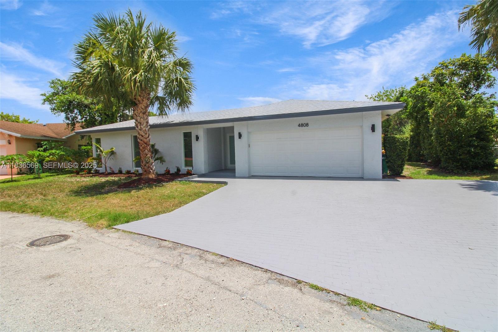 4808 Mango Drive Tamarac, FL 33319 - Photo 3 of 36 a view of a house with a yard