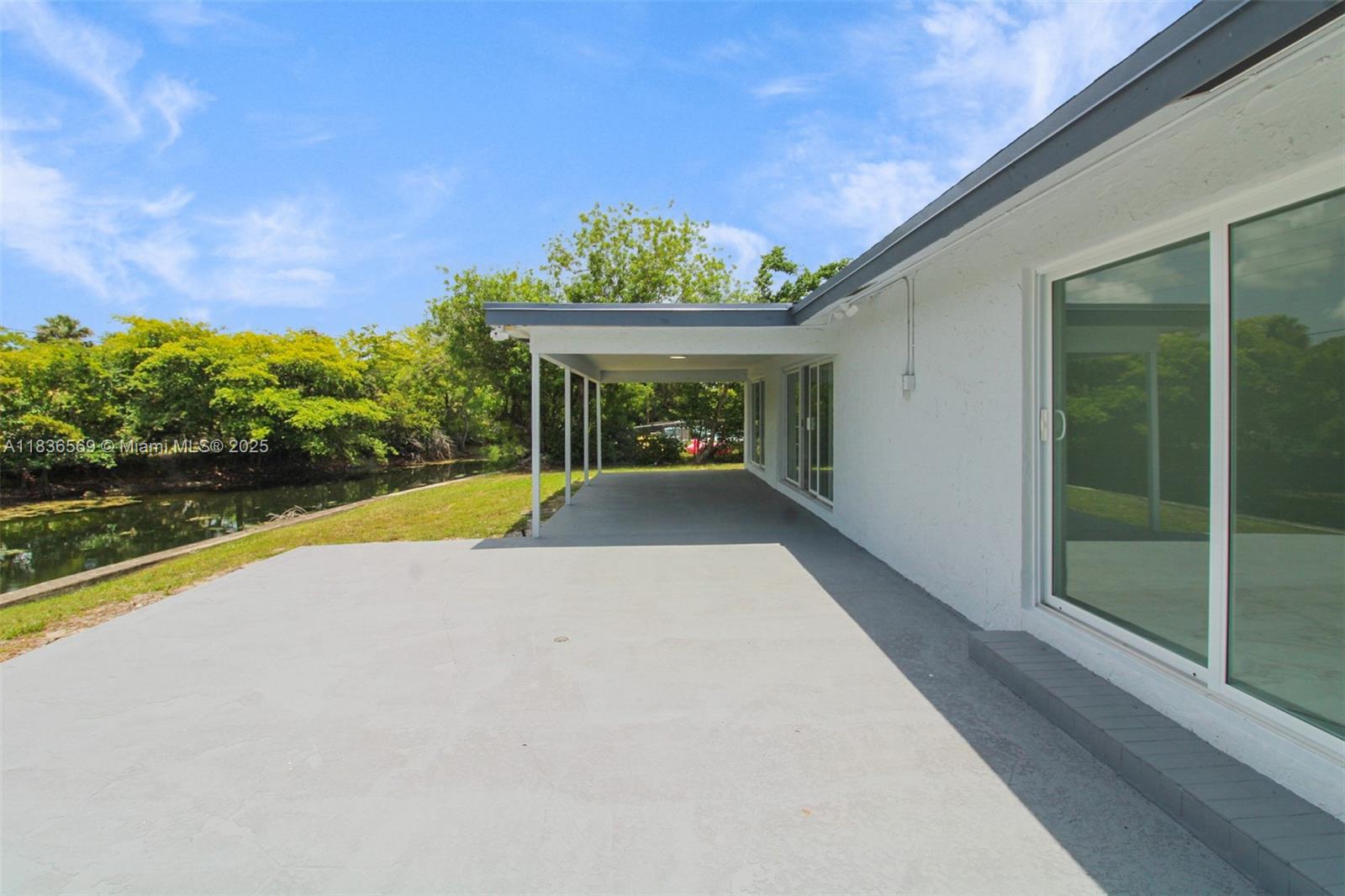 4808 Mango Drive Tamarac, FL 33319 - Photo 32 of 36 a view of swimming pool with a yard