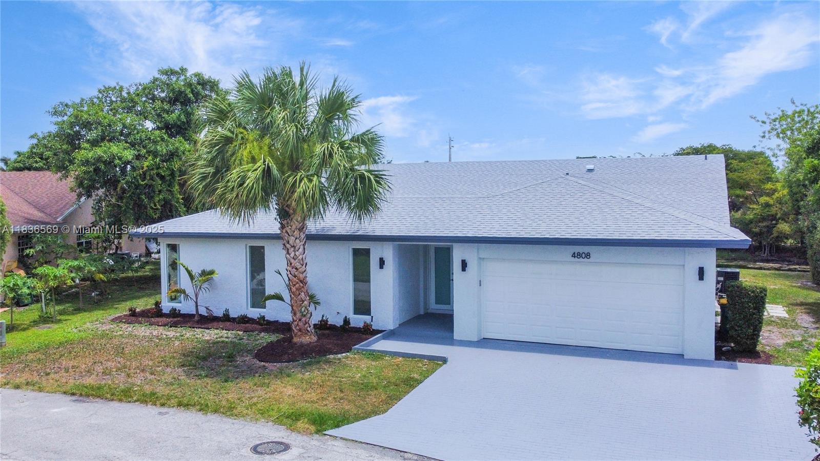 4808 Mango Drive Tamarac, FL 33319 - Photo 5 of 36 a view of a house with yard and entertaining space