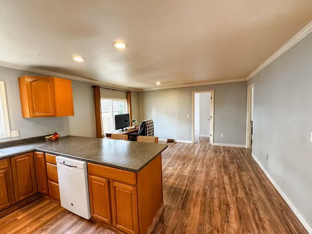 a kitchen with sink and cabinets