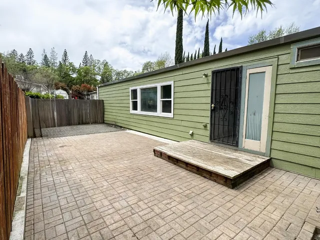 a backyard of a house with seating space