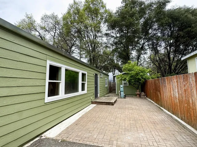a backyard of a house with seating space