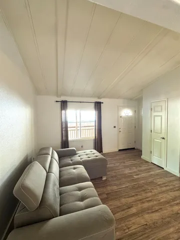 a living room with furniture window and a lamp