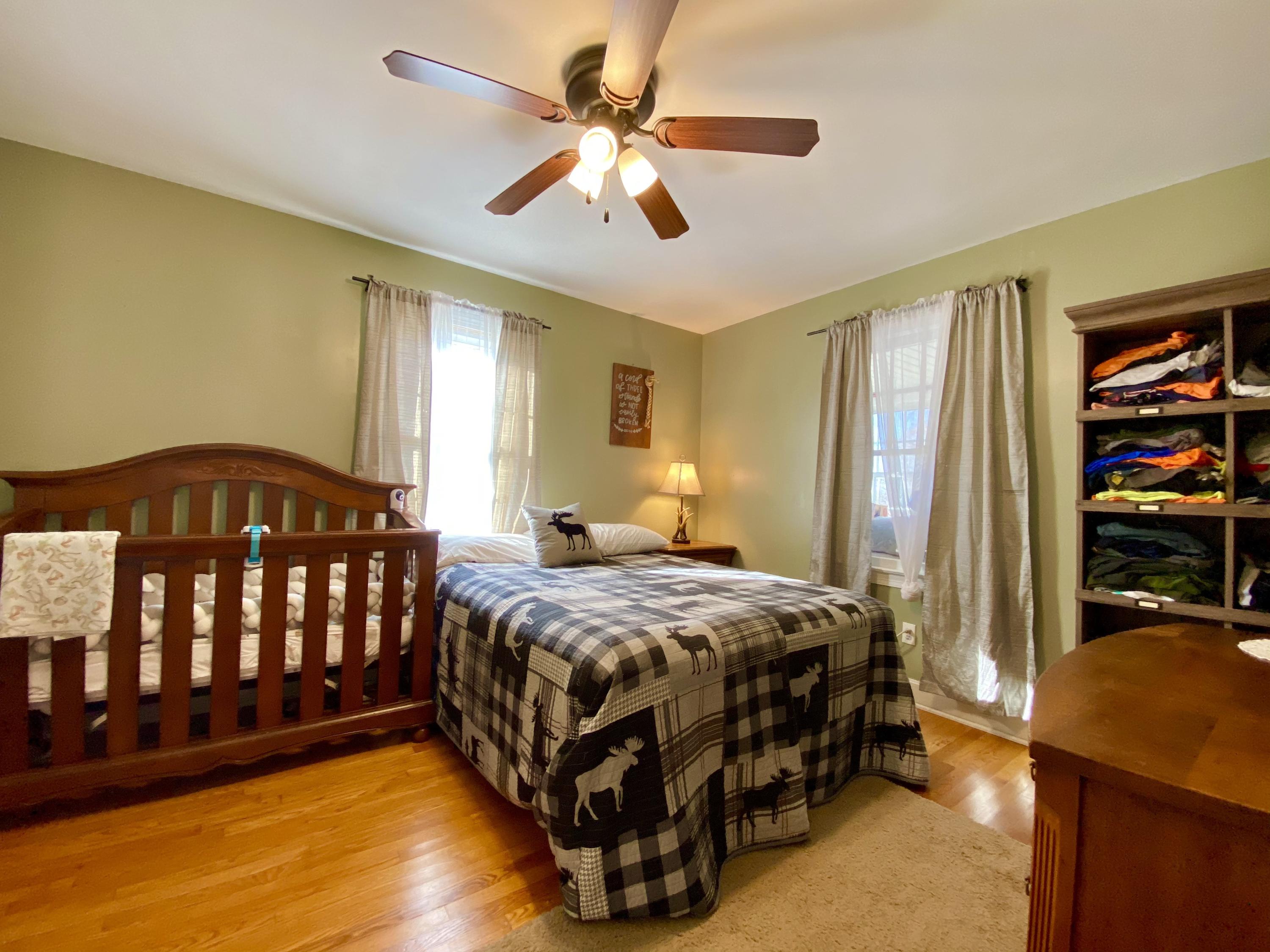 1121 Stone Mill Road Hurt, VA 24563 - Photo 22 of 28 a bedroom with a bed window and a walk in closet