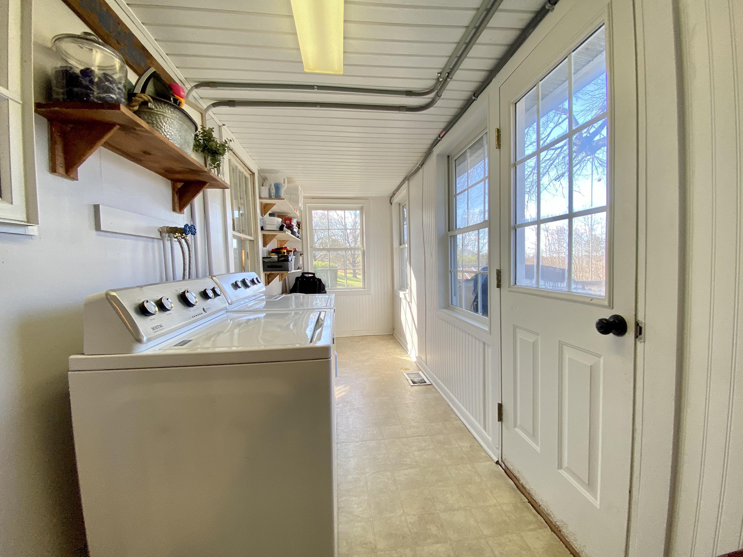 1121 Stone Mill Road Hurt, VA 24563 - Photo 27 of 28 a hallway with a washer and dryer