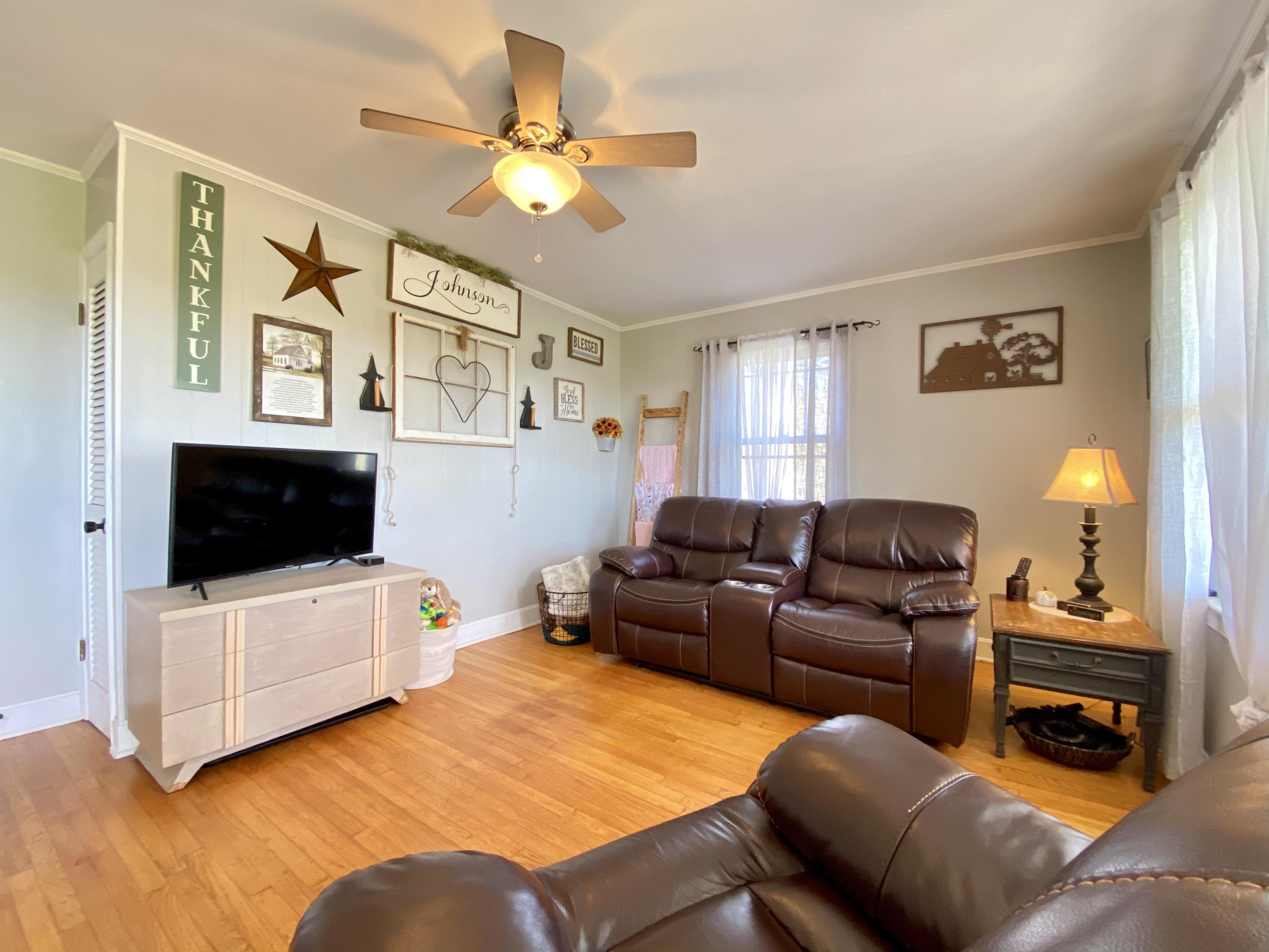 1121 Stone Mill Road Hurt, VA 24563 - Photo 7 of 28 a living room with furniture and a flat screen tv