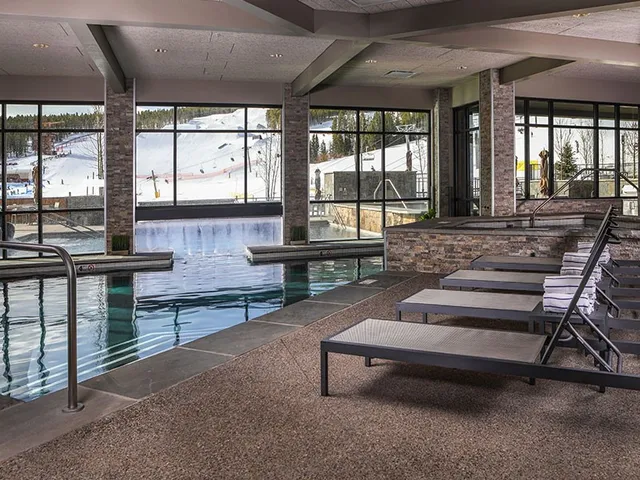 a living room with furniture and windows