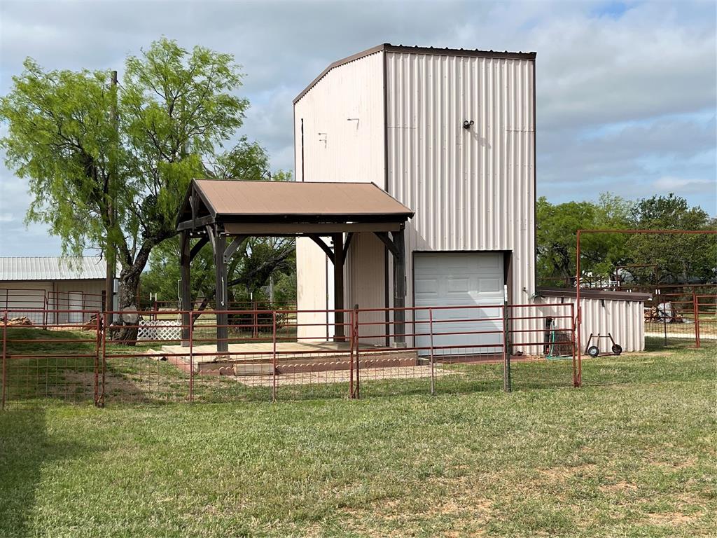 2190 West Fm 574 Road West Mullin, TX 76864 - Photo 14 of 40 a view of a house with a small yard and large tree