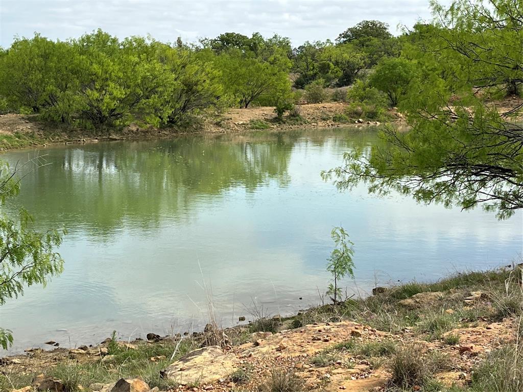 2190 West Fm 574 Road West Mullin, TX 76864 - Photo 17 of 40 a view of a lake with a mountain in the background