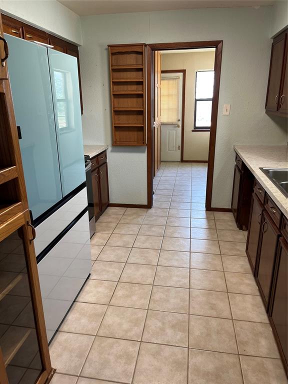 2190 West Fm 574 Road West Mullin, TX 76864 - Photo 31 of 40 a view of a utility room with fridge and windows