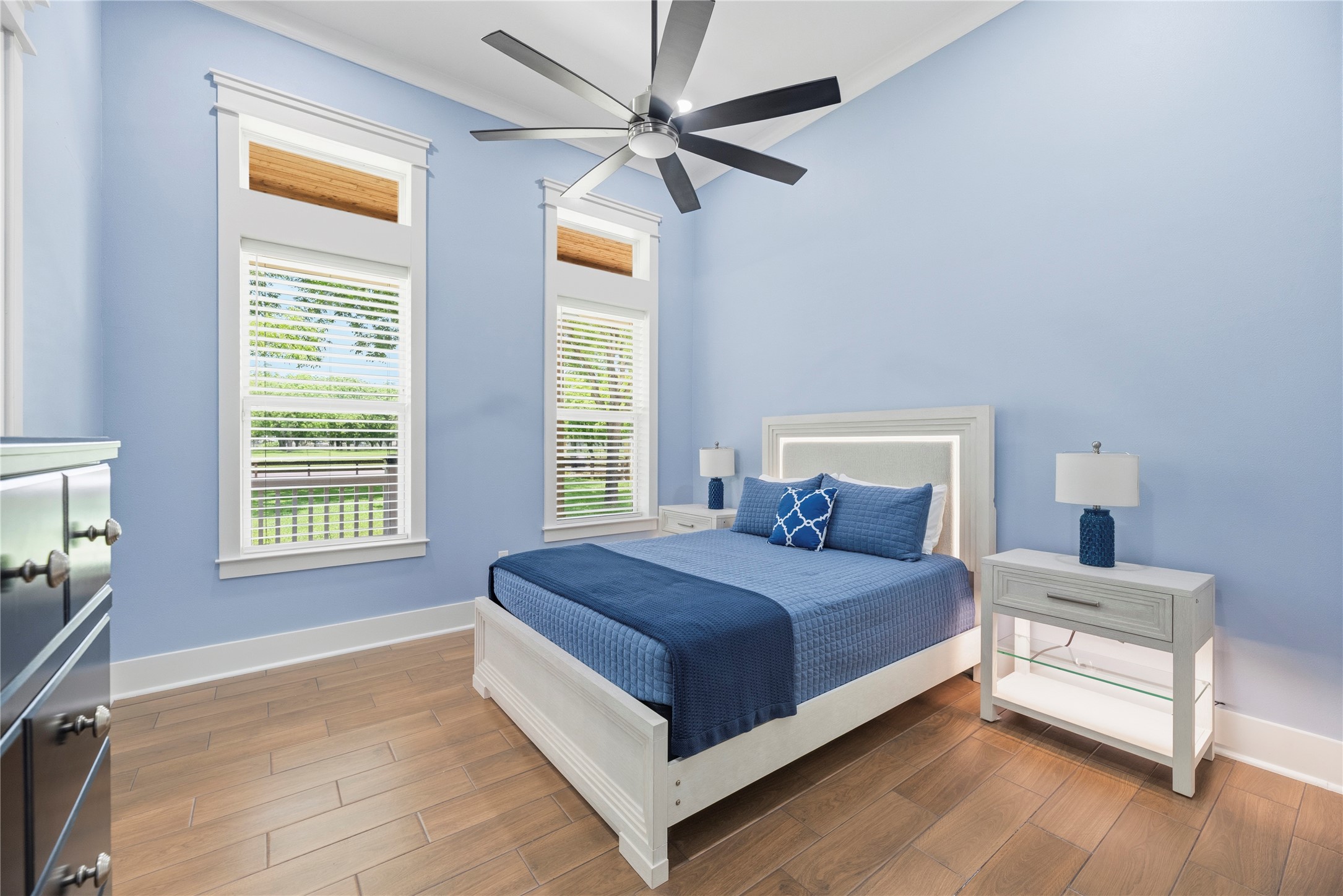 4607 Clayhead Road Richmond, TX 77406 - Photo 19 of 49 Spacious bedroom retreat featuring soaring ceilings, oversized windows, and elegant designer finishes.