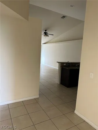 a view of a closet and wooden floor