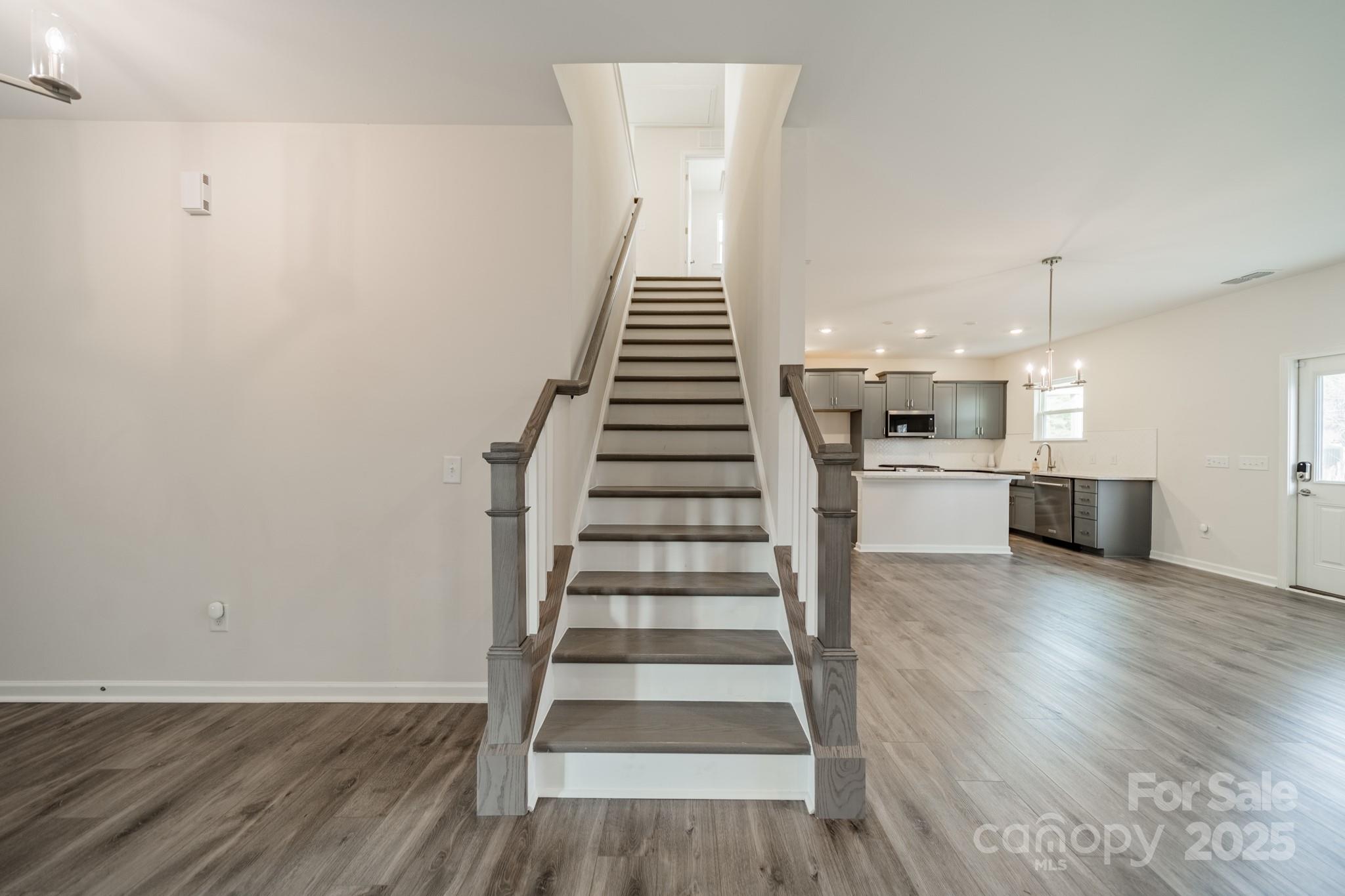 6012 Chumbley Pt Road Charlotte, NC 28215 - Photo 21 of 46 a view of a kitchen with wooden floor and electronic appliances