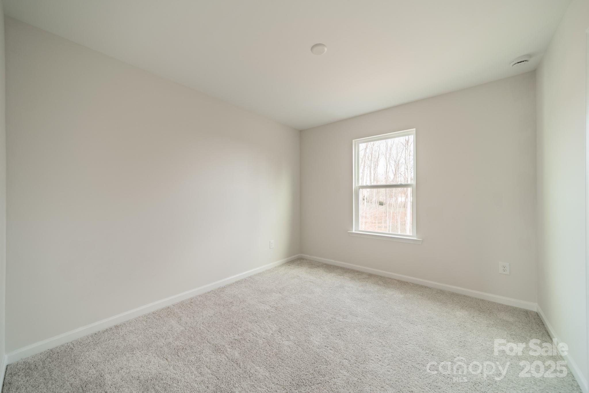 6012 Chumbley Pt Road Charlotte, NC 28215 - Photo 22 of 46 an empty room with a window